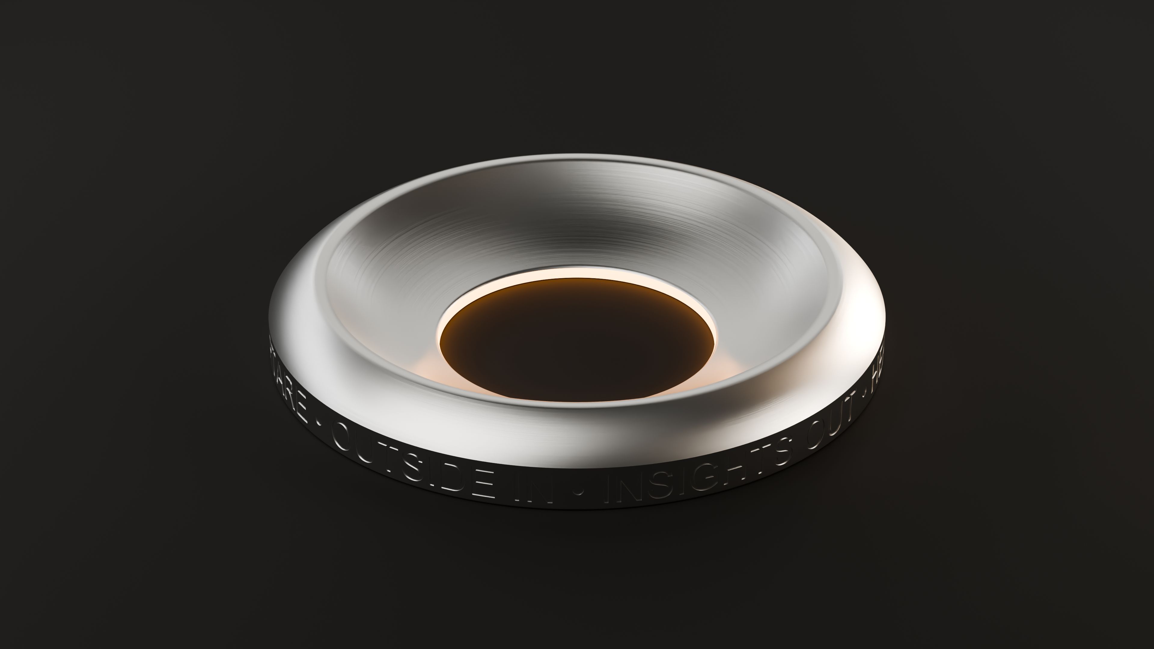 The device from above, glowing amber at the centre